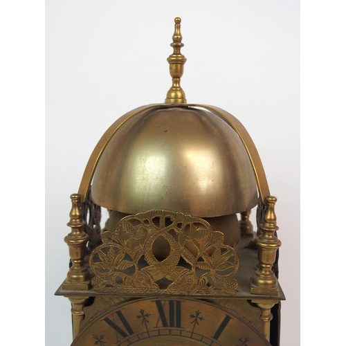 568 - A BRASS LANTERN CLOCK