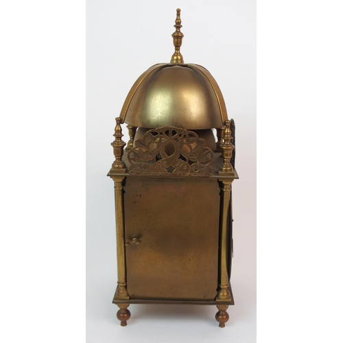 568 - A BRASS LANTERN CLOCK