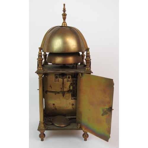 568 - A BRASS LANTERN CLOCK