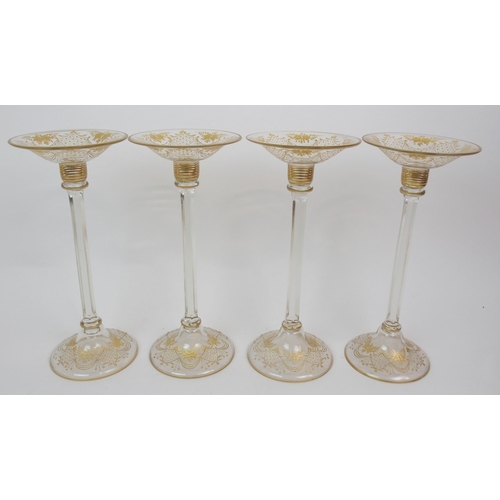 578 - A SET OF FOUR GLASS CANDLE HOLDERS