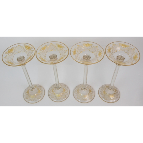 578 - A SET OF FOUR GLASS CANDLE HOLDERS