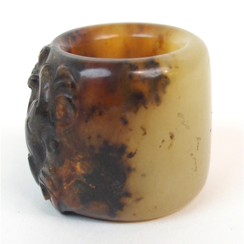 58 - A CHINESE HARDSTONE ARCHERS RING
