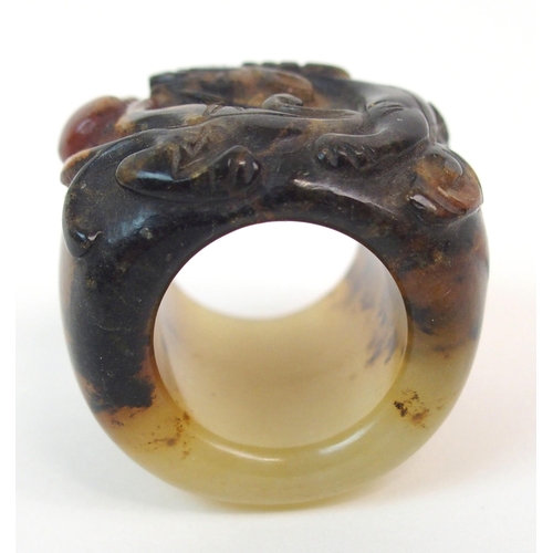 58 - A CHINESE HARDSTONE ARCHERS RING