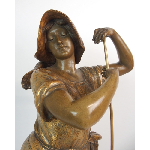 593 - A GOLDSCHEIDER GILDED TERRACOTTA FIGURE OF A FARM GIRL