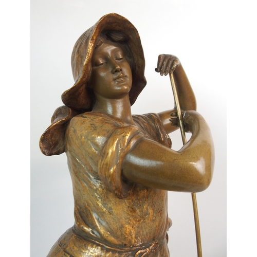 593 - A GOLDSCHEIDER GILDED TERRACOTTA FIGURE OF A FARM GIRL