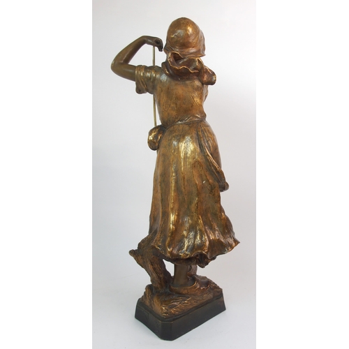 593 - A GOLDSCHEIDER GILDED TERRACOTTA FIGURE OF A FARM GIRL