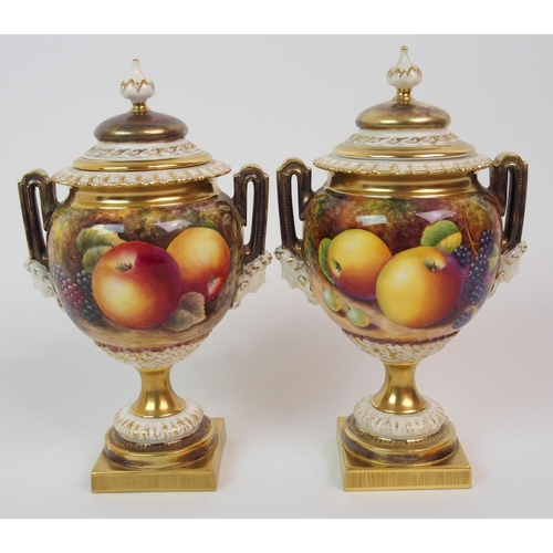 599 - A PAIR OF ROYAL WORCESTER TWO-HANDLED JARS AND COVERS