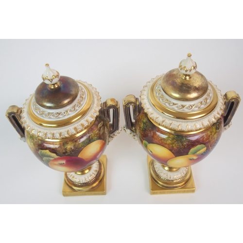 599 - A PAIR OF ROYAL WORCESTER TWO-HANDLED JARS AND COVERS