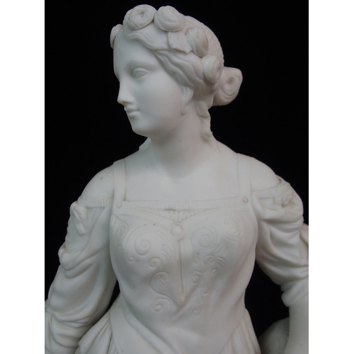 628 - A PARIAN FIGURE OF A WOMAN HOLDING A TAMBOURINE