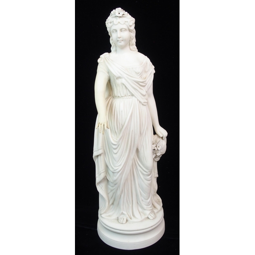 631 - A PARIAN CENTREPIECE MODELLED AS A STANDING WOMAN