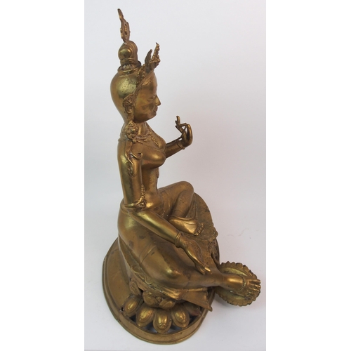 65 - A LARGE BRASS BODHISATTVA