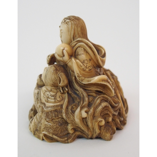 79 - A JAPANESE IVORY NETSUKE OF A LION