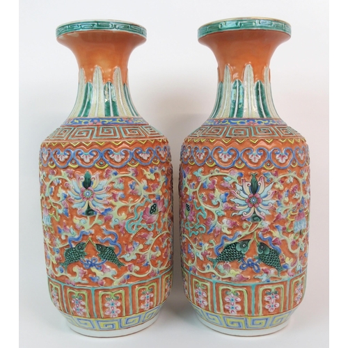 82 - A PAIR OF CANTON RELIEF MOULDED VASES