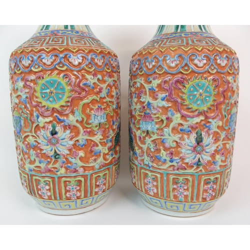 82 - A PAIR OF CANTON RELIEF MOULDED VASES