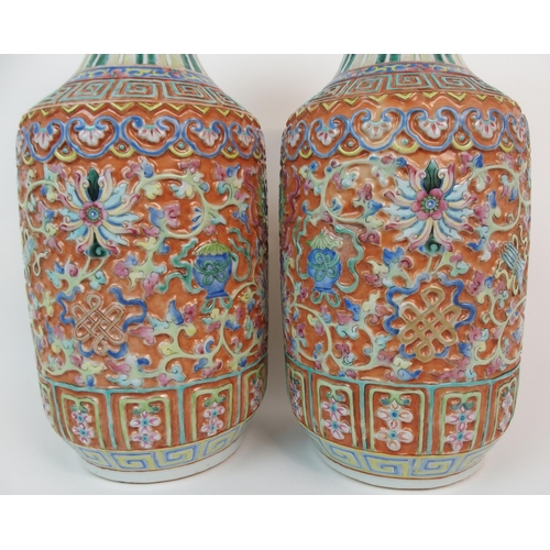 82 - A PAIR OF CANTON RELIEF MOULDED VASES