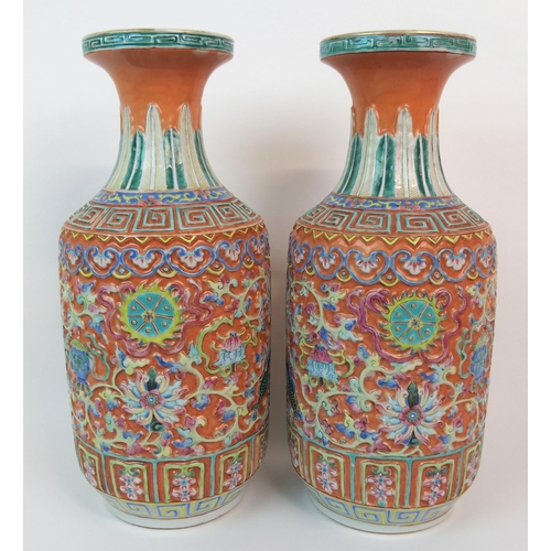 82 - A PAIR OF CANTON RELIEF MOULDED VASES