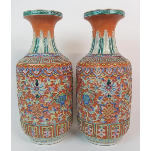 82 - A PAIR OF CANTON RELIEF MOULDED VASES