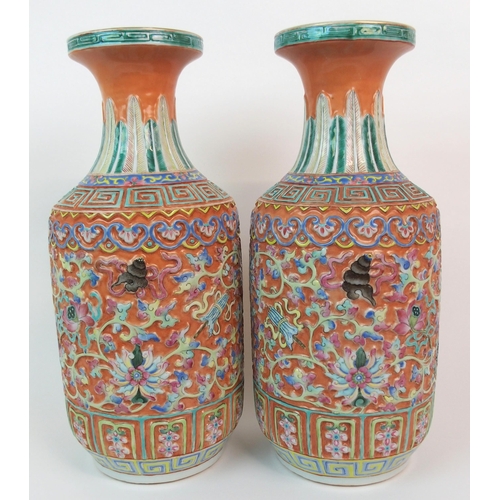 82 - A PAIR OF CANTON RELIEF MOULDED VASES