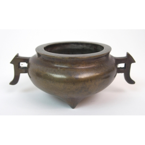 86 - A CHINESE BRONZE TWO-HANDLED CENSER AND HARDWOOD COVER