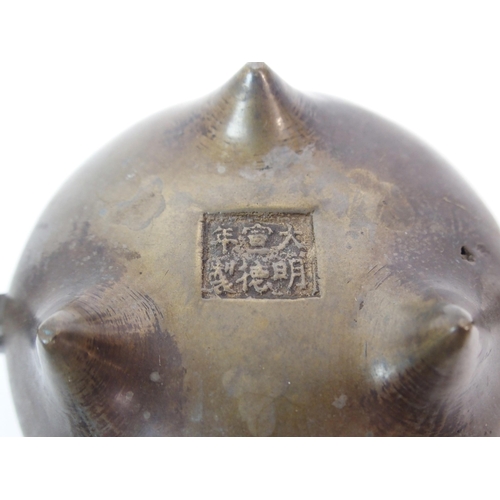 86 - A CHINESE BRONZE TWO-HANDLED CENSER AND HARDWOOD COVER