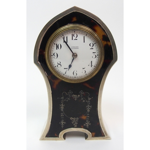 152 - A silver cased and tortoiseshell mounted mantle clock