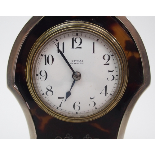 152 - A silver cased and tortoiseshell mounted mantle clock