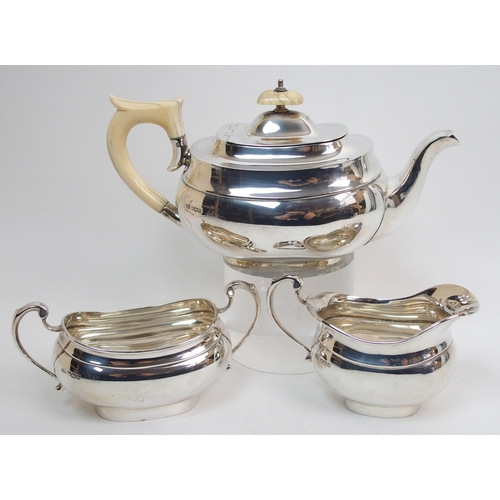 153 - A three piece silver tea service