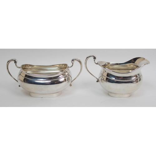 153 - A three piece silver tea service