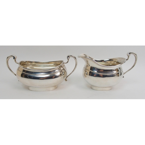 153 - A three piece silver tea service