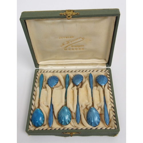 167 - A cased set of six Norwegian silver gilt and blue enamel salt spoons