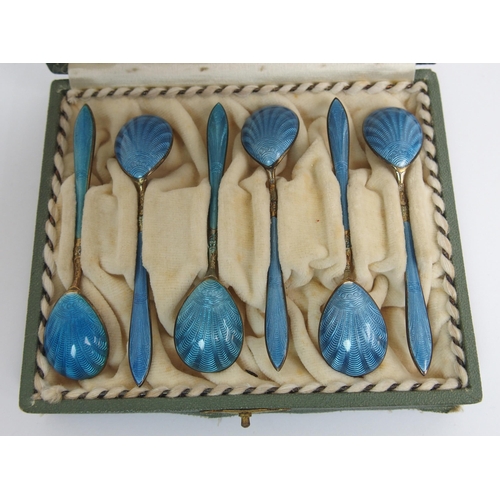 167 - A cased set of six Norwegian silver gilt and blue enamel salt spoons