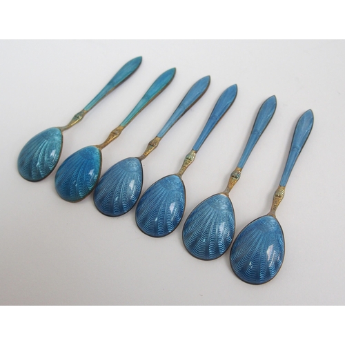 167 - A cased set of six Norwegian silver gilt and blue enamel salt spoons