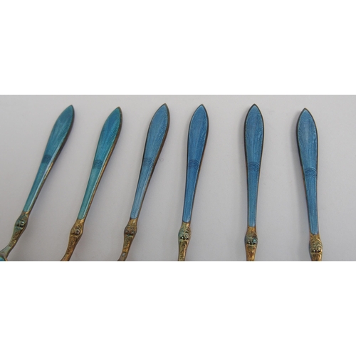 167 - A cased set of six Norwegian silver gilt and blue enamel salt spoons