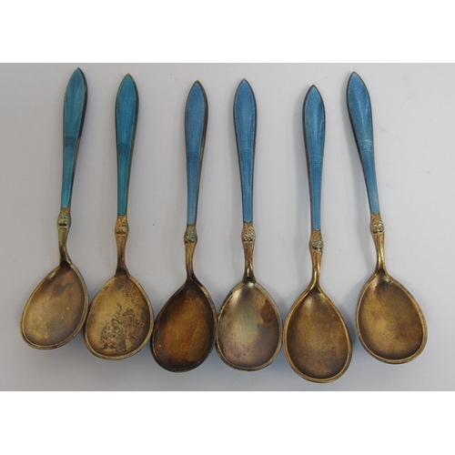 167 - A cased set of six Norwegian silver gilt and blue enamel salt spoons