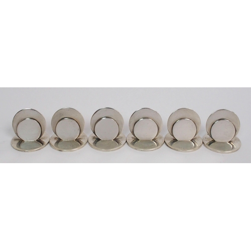 169 - A set of six silver menu holders