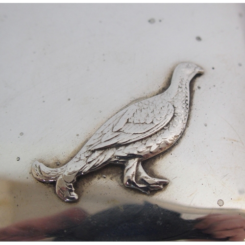 173 - A silver cigarette case decorated with a figure of a Grouse