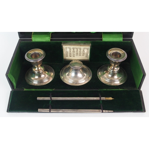 185 - An Edwardian cased silver desk set