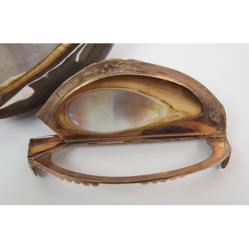 199 - A Cowrie shell and gilt-metal snuff mull