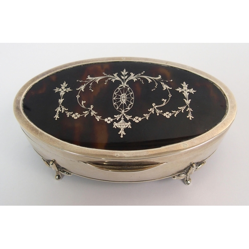 204 - An oval silver and tortoiseshell trinket box