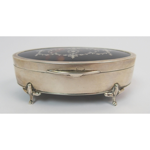 204 - An oval silver and tortoiseshell trinket box