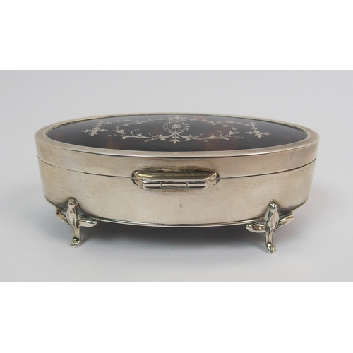 204 - An oval silver and tortoiseshell trinket box