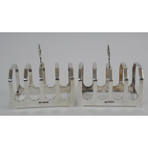 205 - A pair of silver toast racks