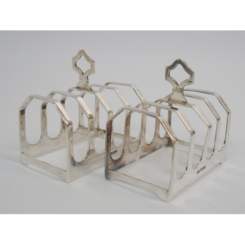 205 - A pair of silver toast racks