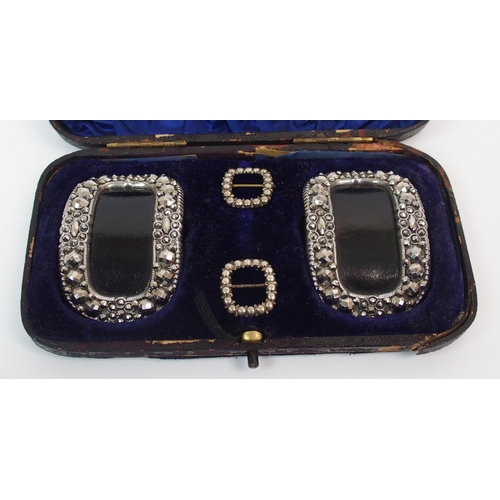 208 - A Georgian cased set of two pairs of buckles