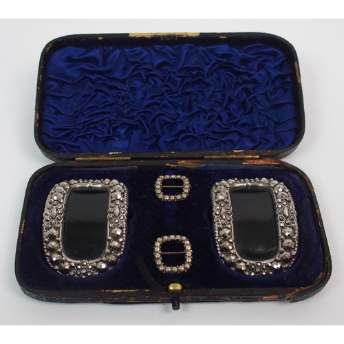 208 - A Georgian cased set of two pairs of buckles