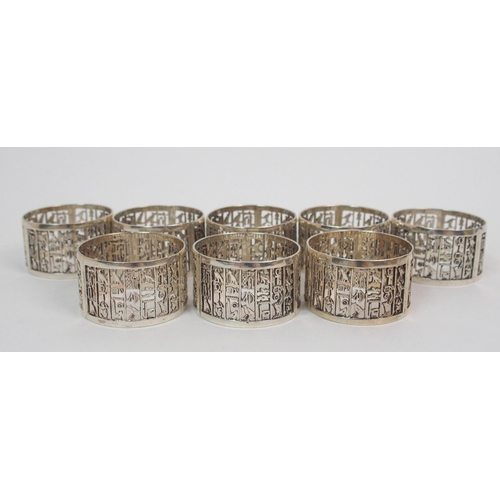 212 - A set of eight Eastern silver napkin rings