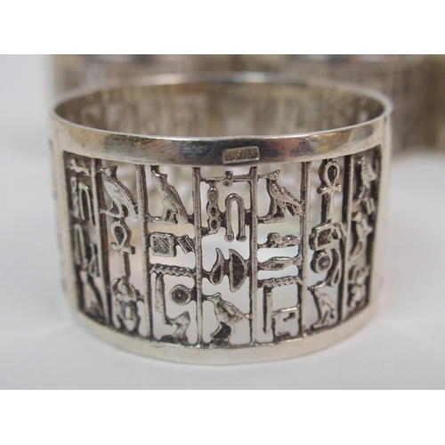 212 - A set of eight Eastern silver napkin rings