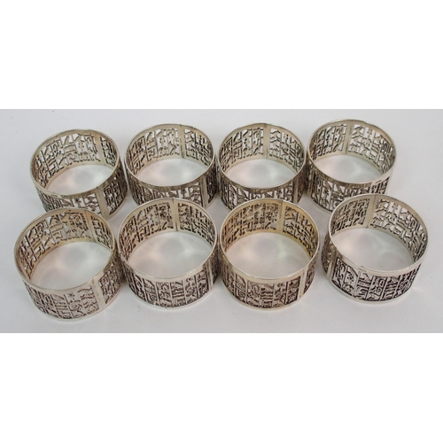 212 - A set of eight Eastern silver napkin rings