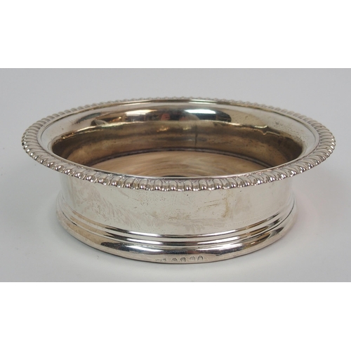 213 - A late George III silver wine coaster