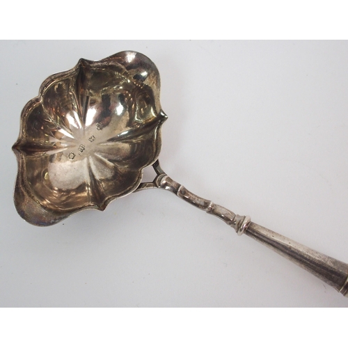 214 - An 18th Century silver bowled toddy ladle